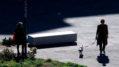 Residents walk their dog in Rome's Prati district. AFP