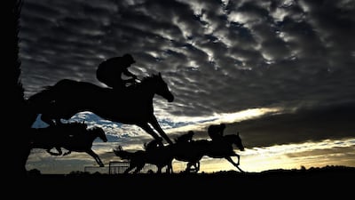 Runners and Riders in action as the sun goes down at Wetherby Racecourse, England. Laurence Griffiths / Getty Images