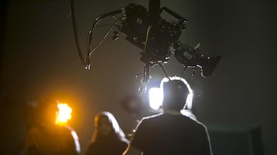 An NYU Abu Dhabi instructor shows young filmmakers how to operate a crane camera at the Arab Film Studio. Silvia Razgova / The National