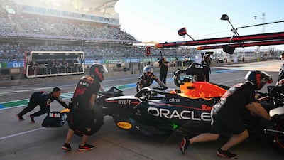 Red Bull Racing driver Max Verstappen is pushed into the garage from the pit lane during the second practice session. AFP