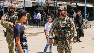 US soldiers in the Syrian town of Ras Al Ain near the Turkish border July 28, 2019. The mixed town is part of large areas in eastern Syria captured by the Kurdish YPG militia, whose rule risks demise because of Washington's troop drawdown. AFP
