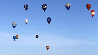 Hot air balloons fly over Dubai during the World Air Games 2015, held under the rules of the Federation Aeronautique International (FAI) as part of the Dubai International Balloon Fiesta event. Karim Sahib / AFP
