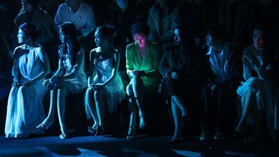 Visitors watch a catwalk show during China Fashion Week in Beijing. EPA