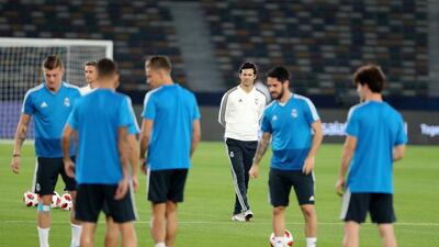 Santiago Solari watches his Real Madrid train on Friday ahead of their Fifa Club World Cup final with Al Ain on Saturday. All photos by Chris Whiteoak / The National