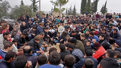 In this file photo taken on November 23, 2018 Mourners attend the funeral of Raed Fares and Hammoud al-Jneid in the village of Kafranbel in the northwestern province of Idlib. AFP