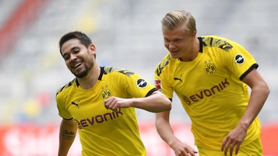 Dortmund's Raphael Guerreiro, left, and Erling Haaland during the Bundesliga match against Fortuna Duesseldorf on Saturday. AP