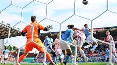 Javi Garcia, second from right, heads in a debut goal for his new club Manchester City to cancel out Peter Crouch's opener for Stoke City at the Britannia Stadium. Adrian Dennis / AFP