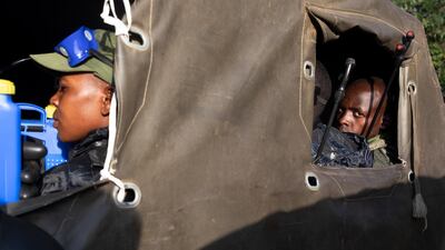 Members of the Uganda People's Defence Force set out with equipment to spray crops with pesticide in Katakwi, Uganda. The insects have already destroyed crops in neighbouring Kenya. Getty Images