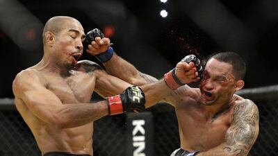 Jose Aldo, left, and Frankie Edgar trade blows during their featherweight championship bout at UFC 200, Saturday, July 9, 2016, in Las Vegas. John Locher / AP Photo