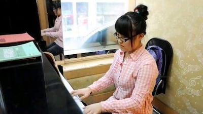 Chu Ziyu, 18, practices piano for more than eight hours a day.