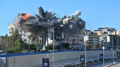 A ball of fire rises from the site of an Israeli strike on a building next to the motorway that leads to Beirut airport. AFP