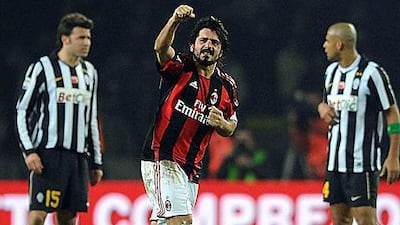 AC Milan's Gennaro Gattuso, centre, celebrates after scoring his first goal in three years to earn his side three points at Juventus.