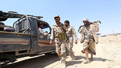 Soldiers loyal to Yemen's government walk at the frontline of fighting against Houthi militants in the central province of Marib on Tuesday. Stringer / Reuters