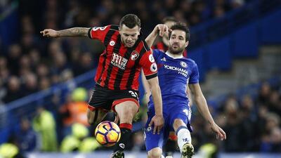 Chelsea midfielder Cesc Fabregas attempts to tackle Bournemouth midfielder Jack Wilshere. Peter Nicholls / Reuters