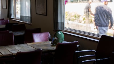 A helmet lies on a table in the clubhouse as Finchley take on North Middlesex at Finchley Cricket Club in London, England. Rob Greig for The National