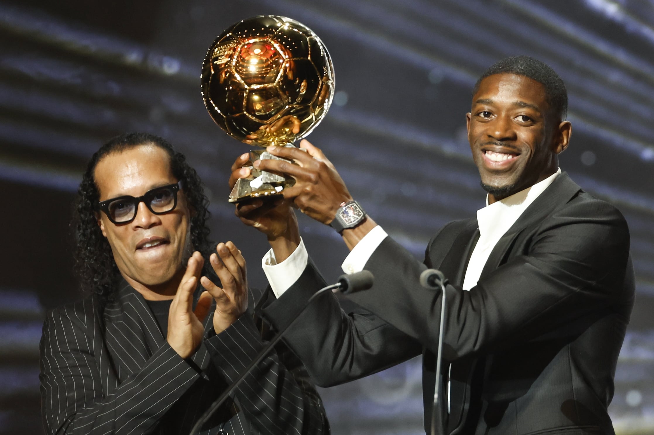 Paris Saint-Germain's Ousmane Dembele, right, wins the 2025 award. EPA