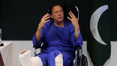 Imran Khan, former prime minister and head of the Pakistan Tehrik-e-Insaf party, speaks to journalists at Shaukat Khanum hospital where he was admitted after being shot, near Wazirabad, in Lahore. EPA
