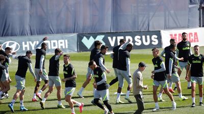 Atletico Madrid players go through warm-up routines at training. EPA