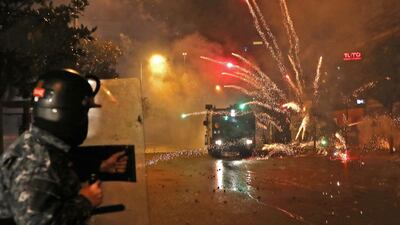 Hezbollah and Amal supporters hurl fireworks at security forces. AFP