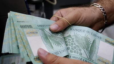 A man counts Lebanese pounds at an exchange office in Beirut, Lebanon, August 16, 2018. Reuters