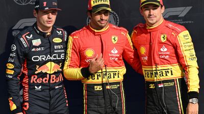 Carlos Sainz, centre, of Ferrari poses after taking pole position, with second-placed Red Bull Racing driver Max Verstappen, left, and and third-placed teammate Charles Leclerc, right. EPA