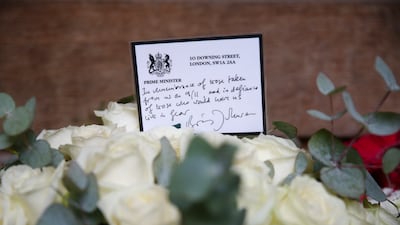 A floral tribute laid on the behalf of British Prime Minister Boris Johnson at the September 11 Memorial Garden at Grosvenor Square on September 11, 2021 in London, England. (Photo by Hollie Adams / Getty Images)