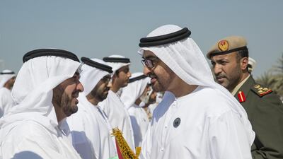 Sheikh Mohammed bin Zayed presents a Martyr’s Medal to a relative of a soldier. Ryan Carter / Crown Prince Court of Abu Dhabi