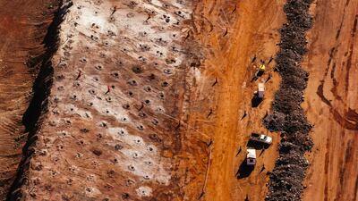 Access roads for trucks line the iron ore excavation pit at the Sishen open cast mine, operated by Kumba Iron Ore Ltd., an iron ore-producing unit of Anglo American Plc, in Sishen, South Africa, on Tuesday, May 22, 2018. Kumba Iron Ore may diversify into other minerals such as manganese and coal as Africa’s top miner of the raw material seeks opportunities for growth and to shield its business from price swings. Photographer: Waldo Swiegers/Bloomberg