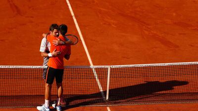Stanislas Wawrinka of Switzerland is congratulated by Novak Djokovic of Serbia after victory in their Men’s Singles Final on day fifteen of the 2015 French Open at Roland Garros on June 7, 2015 in Paris, France. (Photo by Julian Finney/Getty Images)