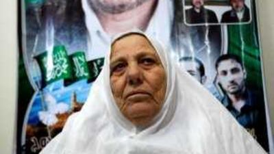 The mother of Mahmoud al Mabhouh holds a picture of her assassinated son.