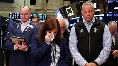Traders observe a moment of silence at the New York Stock Exchange on Thursday, to mark the 24th anniversary of the September 11 attacks. Reuters