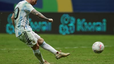 Argentina's Lionel Messi scores a penalty during the shootout.