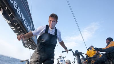 Nick Dana, centre, Azzam's media crew member, co-owns an old car with the bowman of Puma, Casey Smith.