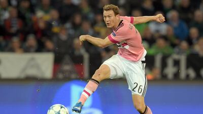 Stephan Lichtsteiner scored the equaliser to lift Juventus to a 1-1 draw in their Uefa Champions League Group D match against Borussia Moenchengladbach in Germany on Tuesday. The Swiss international had been sidelined after heart surgery. Federico Gambarini / EPA