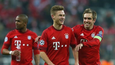 Philipp Lahm (R) team captain of Bayern Munich celebrates victory with his teammate Joshua Kimmich after winning the Uefa Champions League Round of 16 Second Leg match between FC Bayern Munich and Juventus at Allianz Arena on March 16, 2016 in Munich, Germany. (Photo by Alexander Hassenstein/Bongarts/Getty Images)