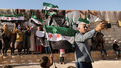 Abdelsalam Al Youssef, director of Teh displaced camp in northern Idlib, takes a selfie during a protest against the proposed closure of Bab Al Hawa crossing in Idlib, Syria. Reuters