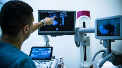 A doctor carries out a mammogram examination used to detect breast cancer. Getty Images