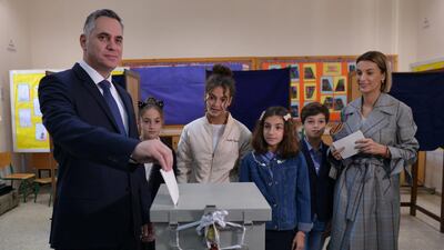 Cyprus presidential candidate Nikolas Papadopoulos leader of the center-right DIKO party, accompanied by his family, casts his ballot at a polling station in Nicosia, Cyprus on January 28, 2018. Stefanos Kouratzis / Reuters