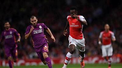 Arsenal's Danny Welbeck runs with the ball next to Galatasaray's Yekta Kurtulus, during the Uefa Champions League Group D soccer match at the Emirates Stadium in London, on Wednesday, Oct 1, 2014. AP Photo/ Tim Ireland