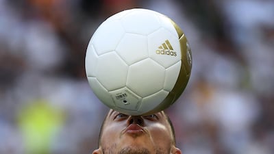 Eden Hazard balances a ball during his unveiling as a Real Madrid player. AFP