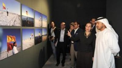 Sultan Bin Tahnoon Al Nahyan, right, is accompanied by the curator Catherine David in the Adach Platform for Visual Arts at the Venice Biennale.