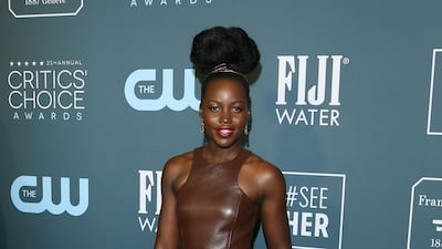Lupita Nyong'o, wearing Michael Kors, arrives at the 25th annual Critics' Choice Awards on Sunday, January 12, 2020. AFP