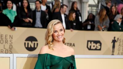 Mega-producer and actress Reese Witherspoon opted for an off-the-shoulder Zac Posen gown in a deep, rich green. Monica Almeida / Reese Witherspoon