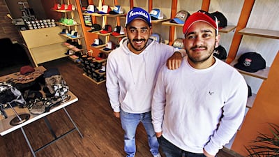 Childhood friends Hareth Hijazi and Abed Qwaider quit well-paying jobs to run a business creating customised caps together. Photo: Charlie Faulkner