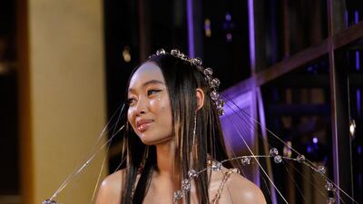 Griff smiles on the red carpet on arrival for the Brit Awards 2021. AFP