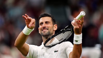 Novak Djokovic pretends to play a violin after defeating Holger Rune. AP