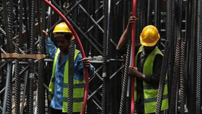 The kingdom’s Saudisation efforts resulted in losses of foreign jobs, most of which were in construction and manufacturing, where companies struggle to meet Saudisation quotas. Hasan Jamali / AP Photo