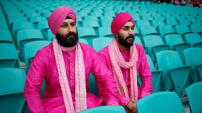 Spectators await the start of play as rain delays the match on Day 3 of the third Test between Australia and West Indies at Sydney Cricket Ground on Tuesday. Zak Kaczmarek / Getty Images