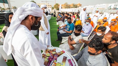 Workers receive snacks.