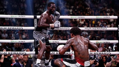 Errol Spence Jr hits the canvas, one of three knockdowns at the hands of Terence Crawford on the night. EPA